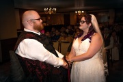 Tess-and-Adam-at-alter-with-ribbon